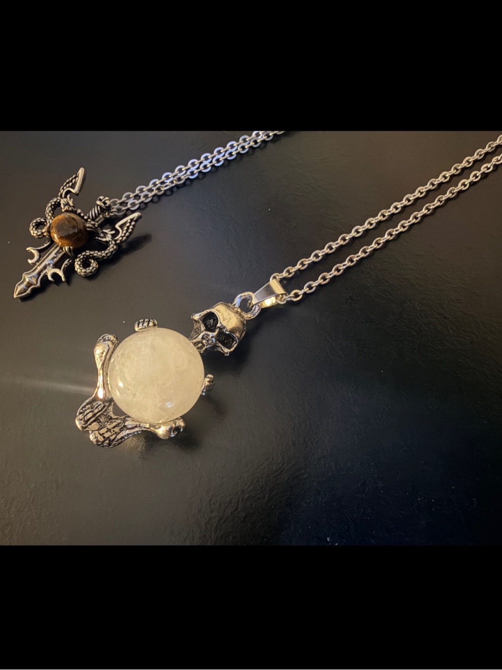 Bundle of 2 Tigers Eye Crystal Sword and Moon Stone Skull Silver 20” Necklaces
